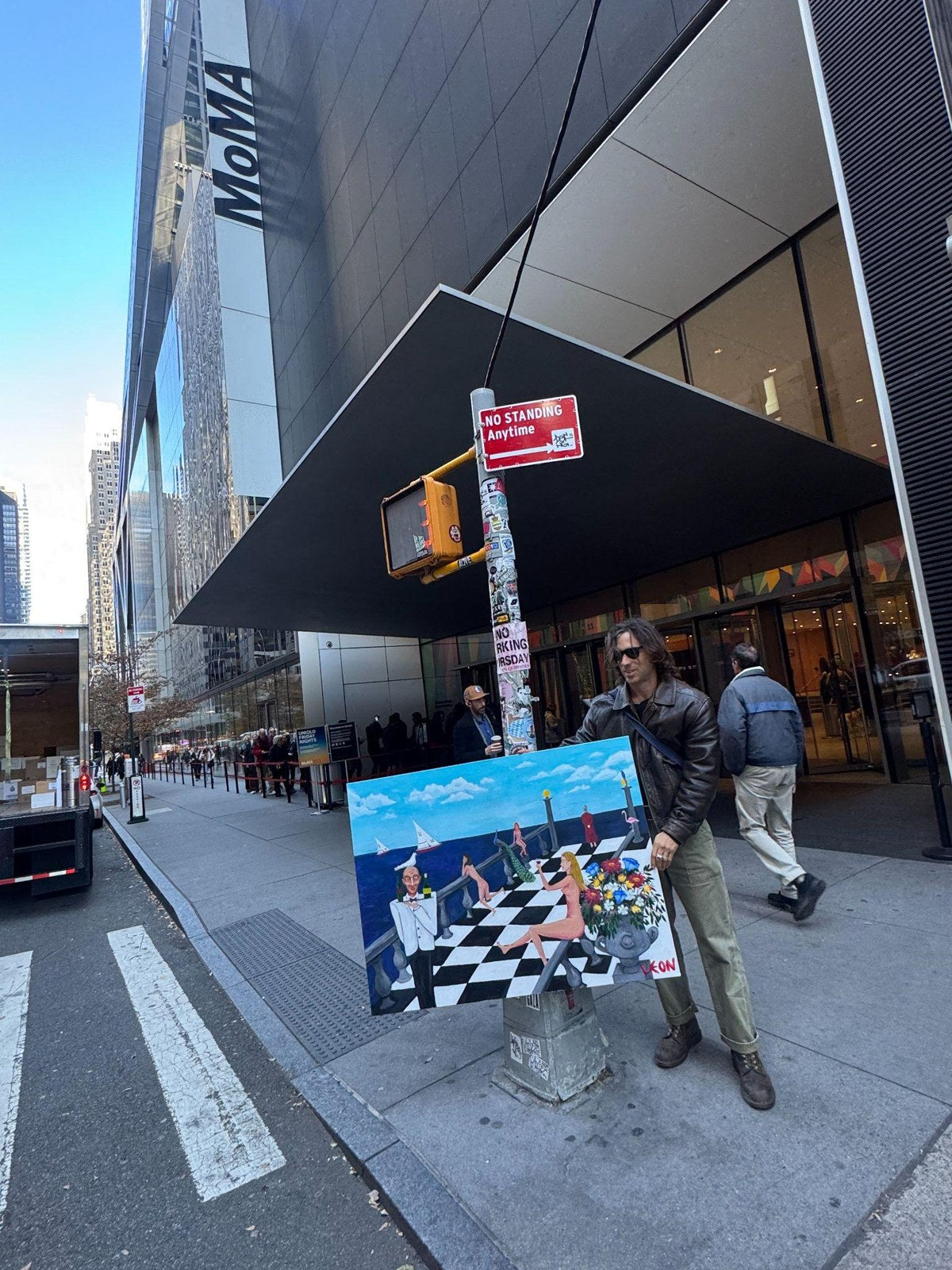 Leon Cummins with his painting outside MoMA NYC
